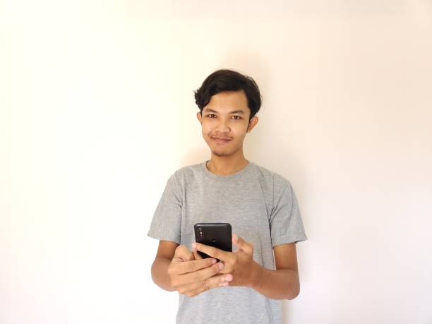 istock Wow and surprise face asian man use smartphone with copy space of advertisement 1484390922