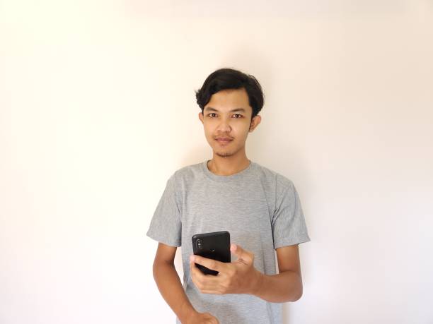 istock Wow and surprise face asian man use smartphone with copy space of advertisement 1484390924