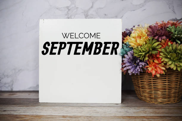 istock Welcome September text message with flower in basket decoration on marble background 1484392680