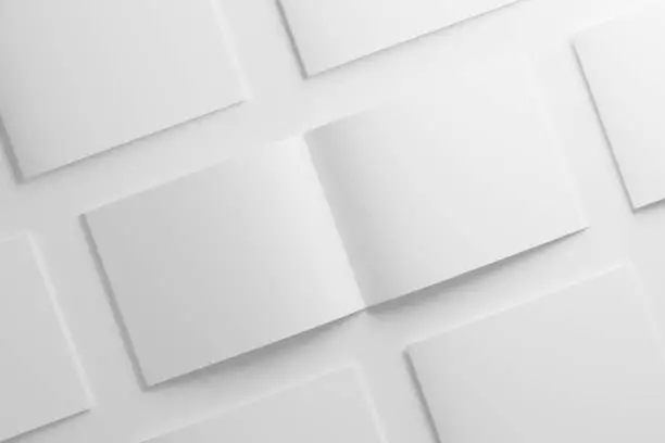 Photo of US Letter Landscape Saddle Stitch Bifold Brochure Catalog White Blank 3D Rendering Mockup