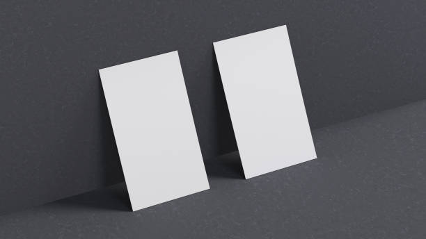 istock Realistic vertical business cards mockup with shadows effects on a gray stone background 1484410916