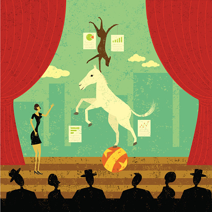 A businesswoman presenting her dog and pony show to other business people. The woman, dog and pony are on a separate labeled layer from the stage and audience.