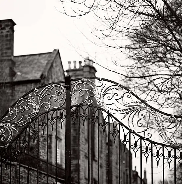 An old gate in Durham, England. Focus on the gate. Black and white film photography