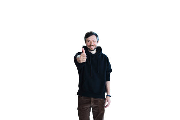 Young bearded smiling handsome man in casual clothes posing isolated on white background and giving thumbs-up