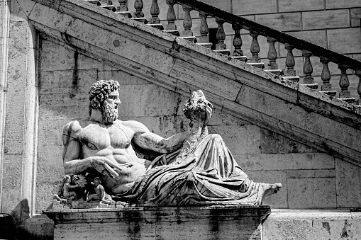Sculpture of the eternal city, where we see a man leaning on his arm contemplating a scene in the distance.\nRome 2014