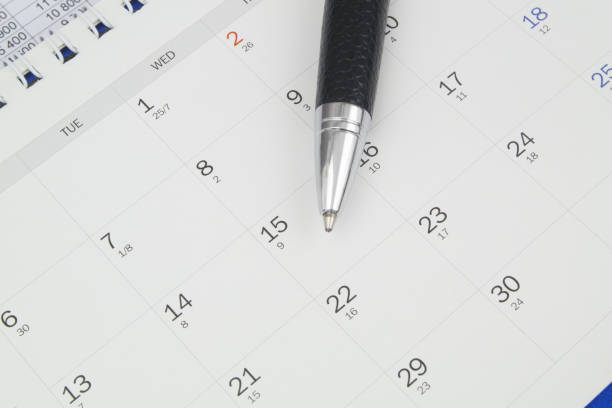 istock Black metal pen on calendar page 1484427230