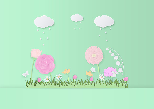Natural garden scene design with flowers, grass, butterfly, cloud, and rain on a green background. Paper art design.