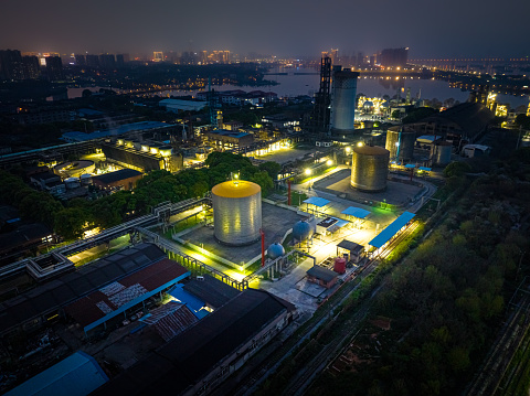 Aerial view of industrial storage tanks at night