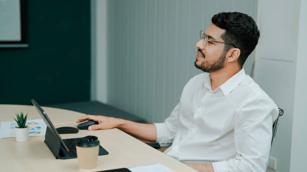 istock Young Businessman Raising Hand to Ask Question After Business Presentation. 1484451301
