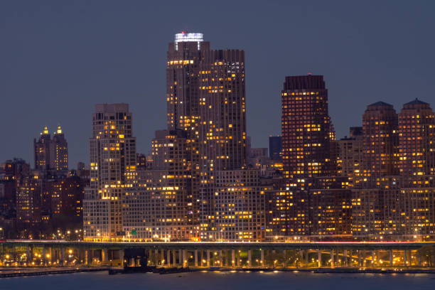 istock Manhattan skyscrapers during dusk sunlight, modern buildings 1484453379