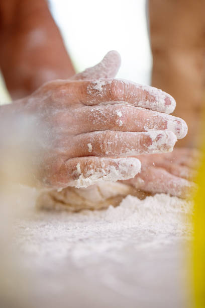 istock Male hands preparing a dough for homemade pasta 1484455009