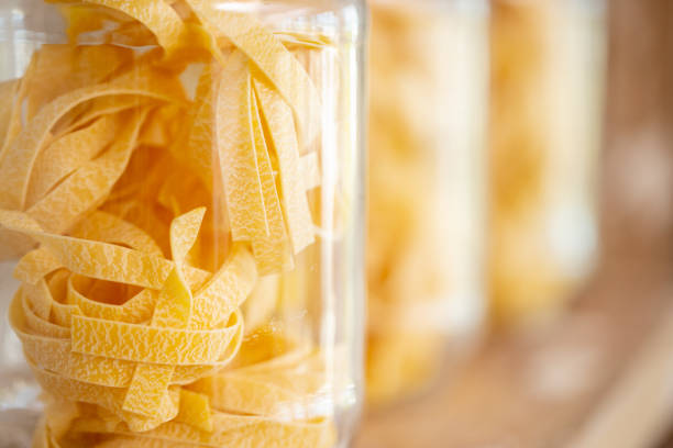 Fettuccine Italian pasta in a glass jar stock photo
