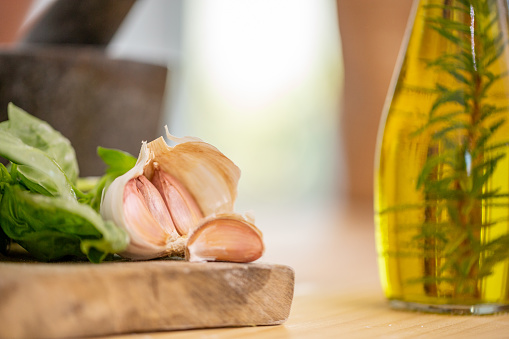 Rosemary infused oil, garlic and fresh basil. Typical Italian and Mediterranean cooking spices and herbs