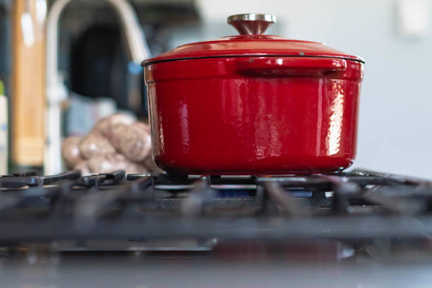istock Raw meat sausage ready to be boiled in a red pot 1484459776