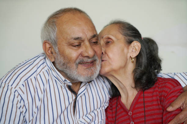 istock Senior couple embracing at home 1484461379