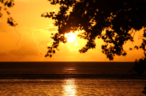 Albion, Mauritius - April 22, 2023: Vibrant colors during sunset at the Indian Ocean close the public beach of Albion in the West of Mauritius.