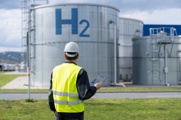 Engineer on a background of Hydrogen factory Engineer with tablet computer on a background of Hydrogen factory hydrogen stock pictures, royalty-free photos & images