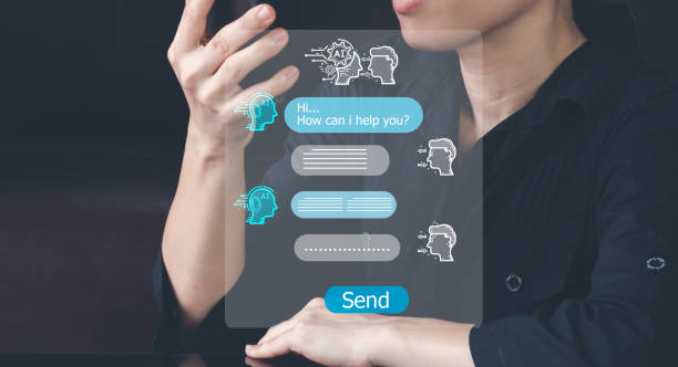istock Business woman chatting with chatbot via mobile smart phone application while working on laptop computer. Chatbot assistant conversation, Ai Artificial Intelligence technology concept. 1484462924