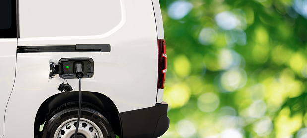 Electric delivery van on a green background