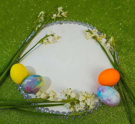 Happy easter! Flat Lay, postcard or Internet banner with Copy Space on Easter.  Snowdrop flowers and easter eggs