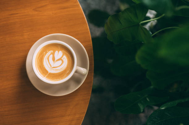 istock A Work of Art: Cappuccino and Latte Design on a Rustic Wooden Table 1484464615