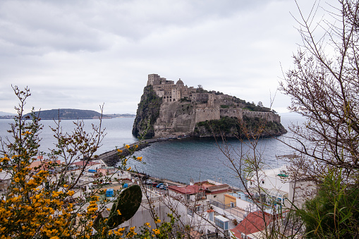 residential buildings under the Aragonese castle on Ischia island in the bay of Naples, Italy