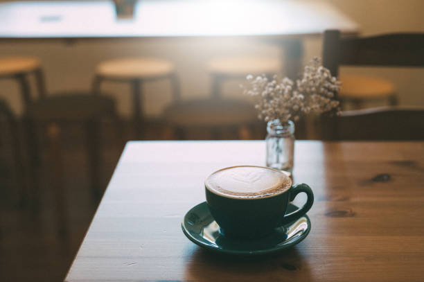 istock The Art of Mornings: Cappuccino and Latte Design on a Wooden Table in the Soft Light 1484464698