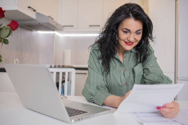 istock Mature woman going through paperwork 1484466051