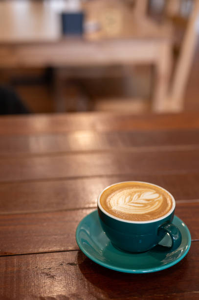 istock A Work of Art: Cappuccino and Latte Design on a Rustic Wooden Table 1484466730