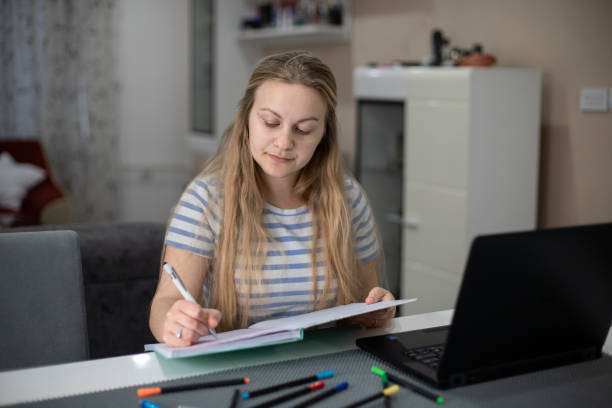 istock Young woman studying at home 1484467121