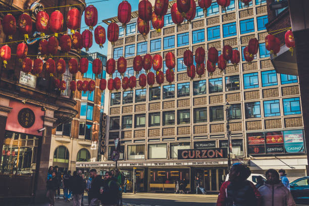 On the street in London.  The Iconic Curzon theatre in Soho with Chinese lanterns in the foreground.  Taken from Chinatown in Soho, London