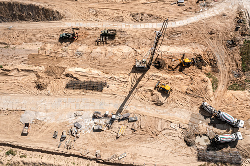 hydraulic drilling rig at construction site. heavy construction equipment for foundations construction work. aerial top view.