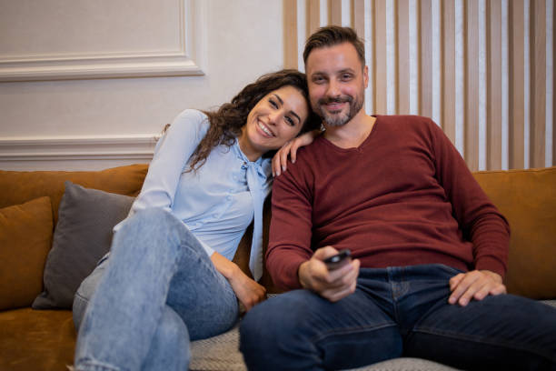 istock Young couple watching TV 1484470631