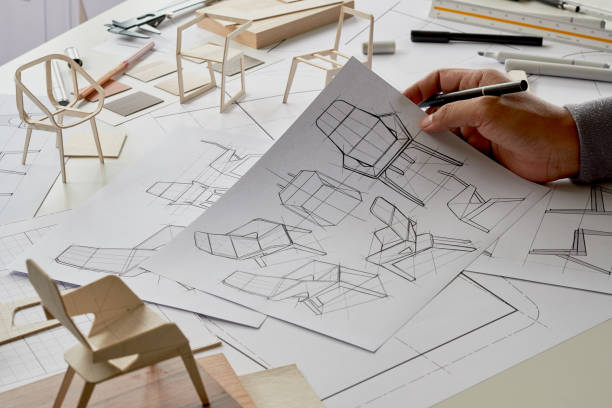 istock Designer sketching drawing design development product plan draft chair armchair Wingback Interior furniture prototype manufacturing production. designer studio concept . 1484470772