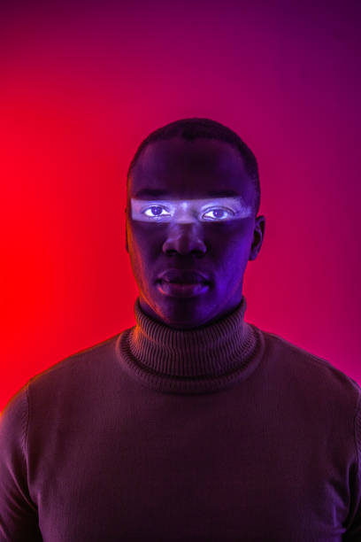 istock Mans face with horizontal strip of reflected light across his eyes 1484470791