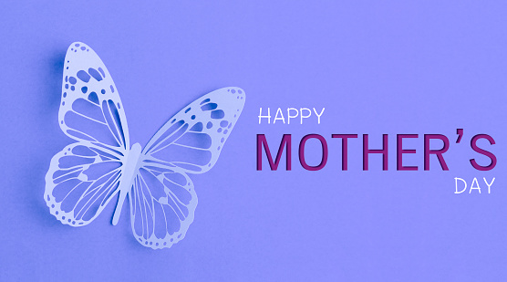 Happy Mother's Day with butterfly paper cut on purple cardboard.