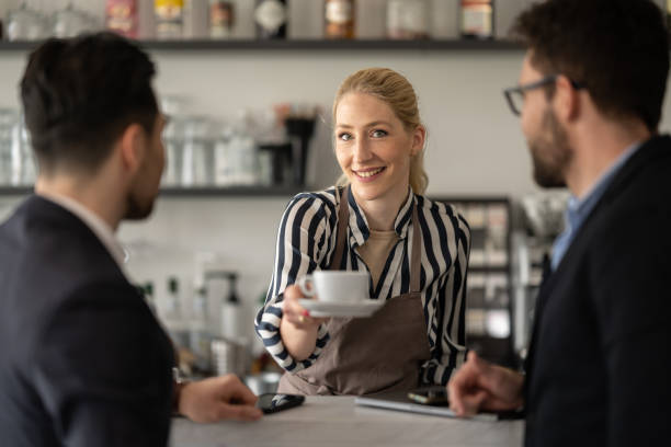 istock Communication between the bartender and the visitors of the cafe 1484473263