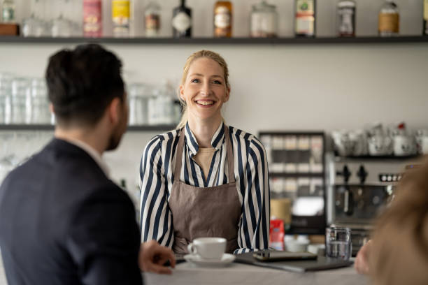 istock Communication between the bartender and the visitors of the cafe 1484473268