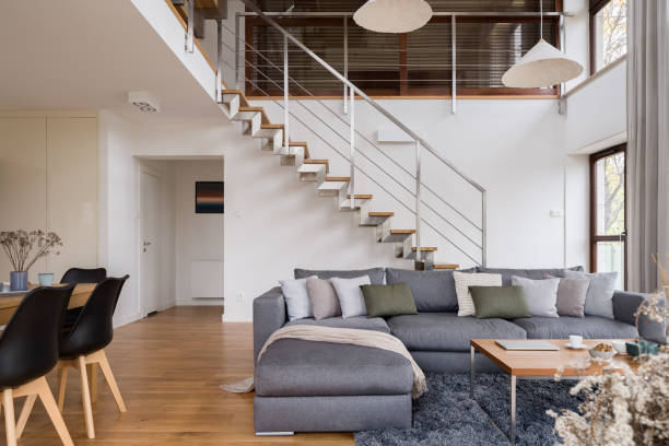 istock Spacious living room with stairs 1484475684