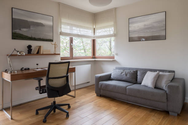 istock Simple room with desk and couch 1484475685