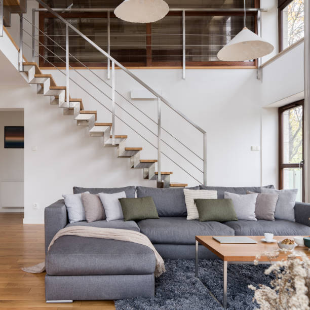istock Big corner sofa in living room with stairs 1484475706