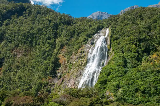 Photo of Magnificent waterfall, Milford Sound (Piopiotahi) fjord, Fiordland National Park in the south west of New Zealand's South Island. World heritage site among the world's top travel destinations