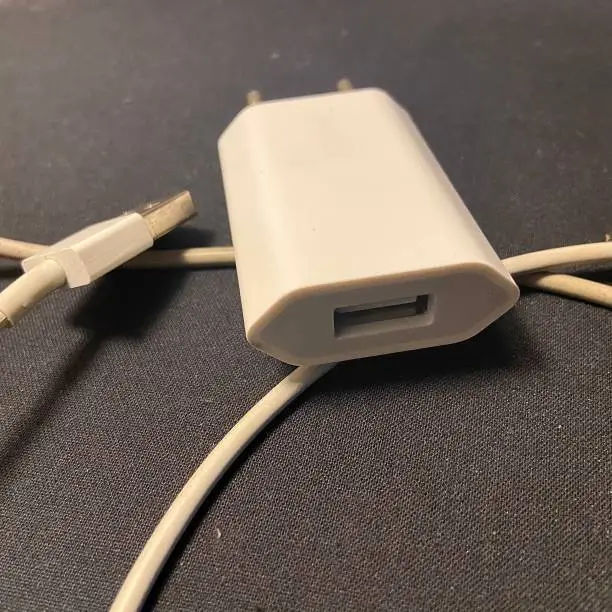 Photo of Apple USB connection cable for iPhone and iMac.