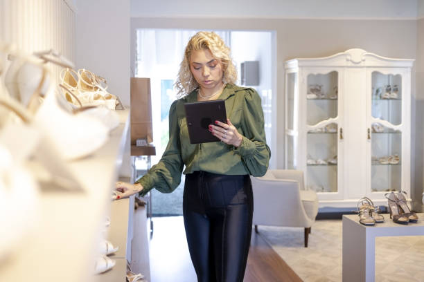istock Woman in a shoe store 1484491034