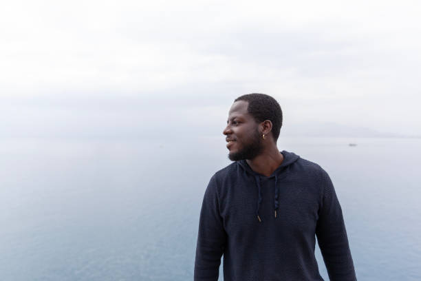 Rearview shot of a man looking at the ocean view