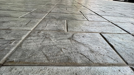 Perspective View of Monotone Gray Brick Stone on Floor Background