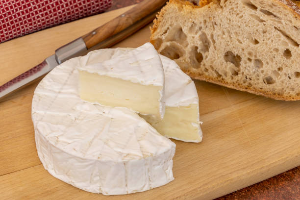 istock camembert cut on a wooden board with bread 1484497067