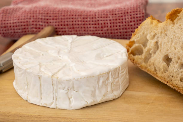 istock whole camembert on a wooden board with bread 1484497079