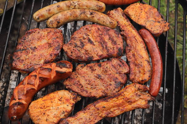 Meat and sausages on the grill stock photo