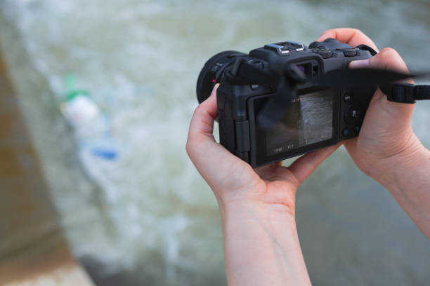 Free Stock Photo of Hand Holding Camera Over Body of Water | Download ...
